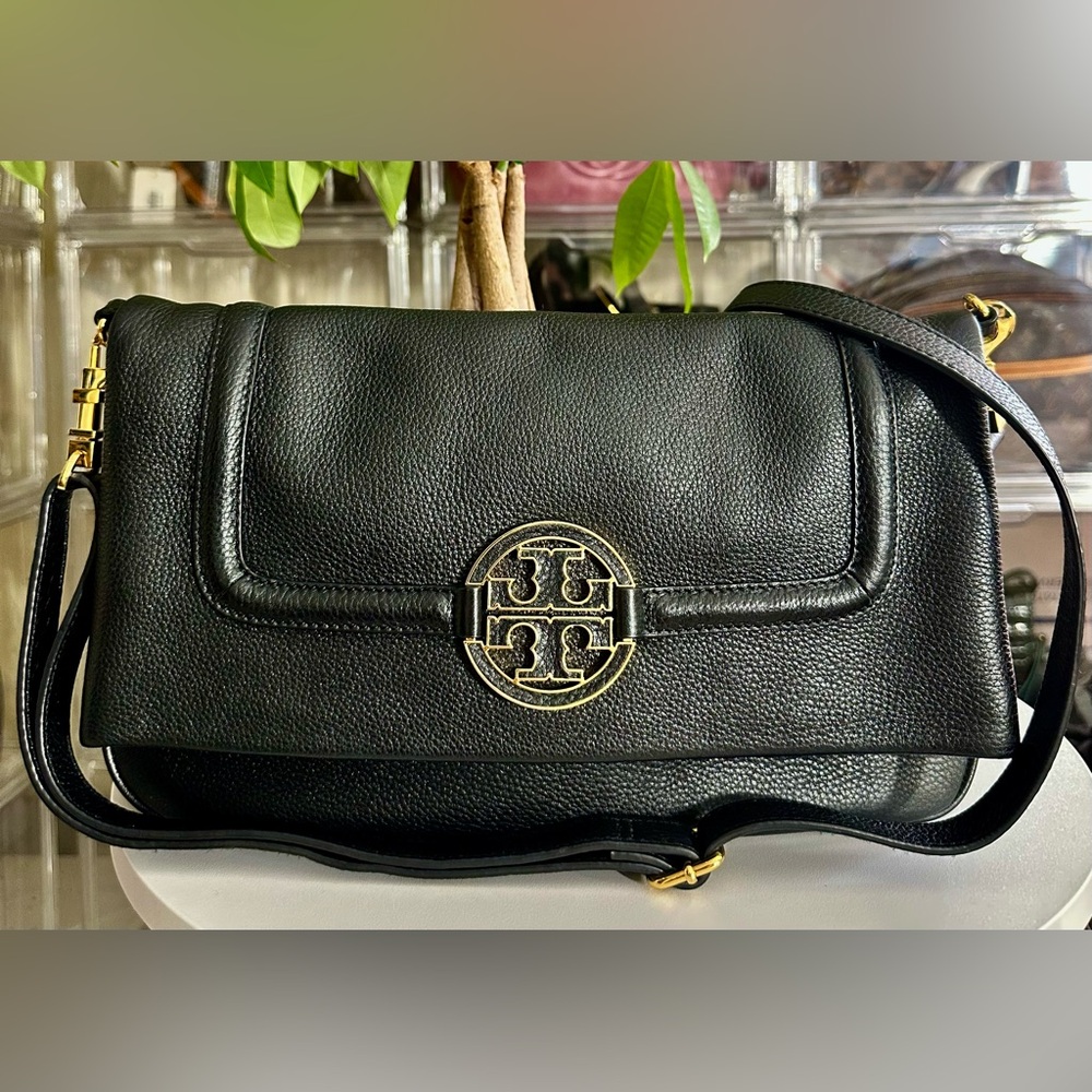Tory Burch Black Leather Bag with Gold Emblem folded dual strap attachment.